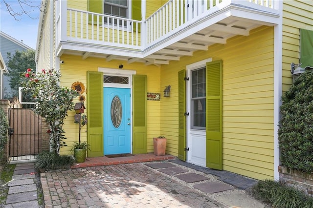 entrance to property with a balcony