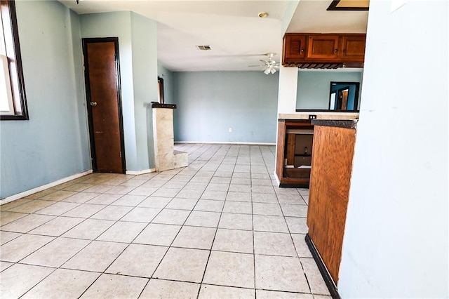 kitchen with ceiling fan and light tile patterned floors