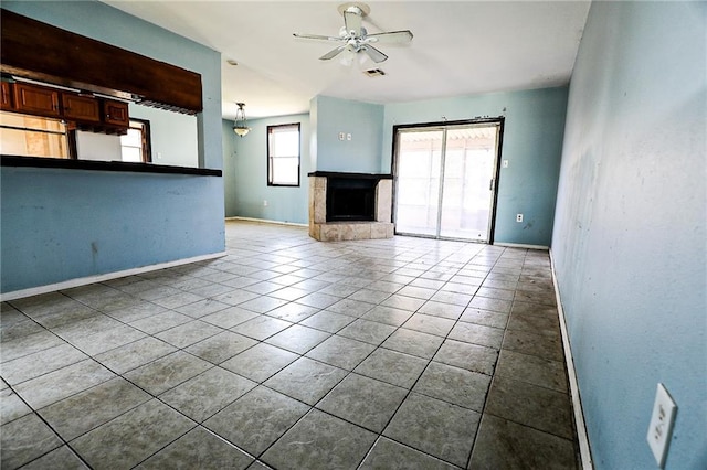 tiled empty room with ceiling fan