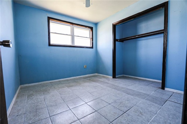 unfurnished bedroom featuring a closet and ceiling fan