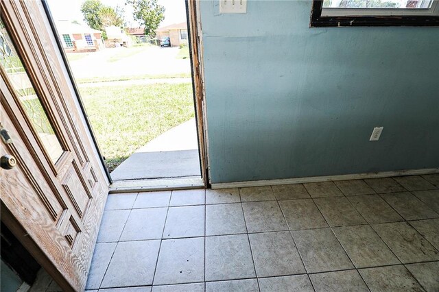 kitchen with stainless steel range oven and light tile patterned floors