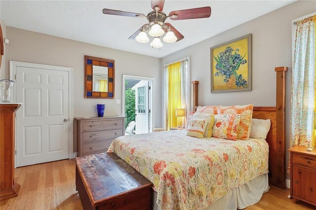 bedroom with ceiling fan and light wood-type flooring