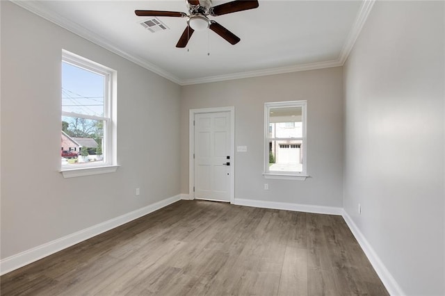 unfurnished room with ceiling fan, wood-type flooring, and ornamental molding