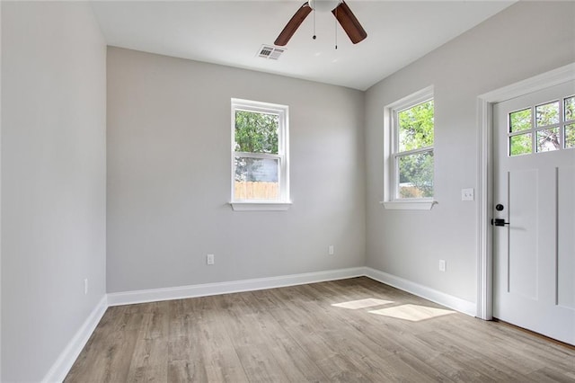 unfurnished room with light hardwood / wood-style flooring and ceiling fan