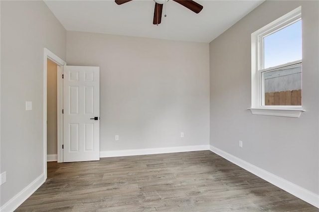 spare room featuring ceiling fan and wood-type flooring