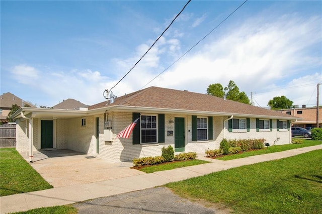 single story home featuring a front yard and a carport