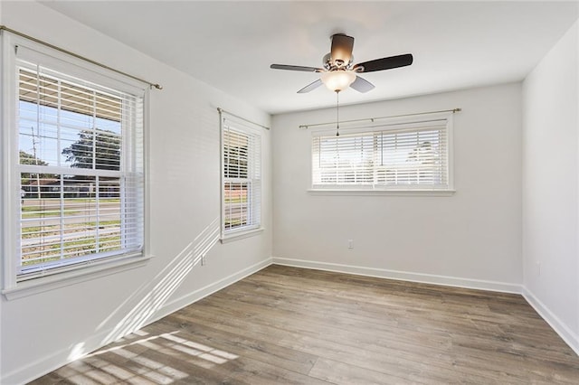 200-202 Pink St, Metairie, LA 70005 - spare room featuring wood finished floors, baseboards, and a ceiling fan