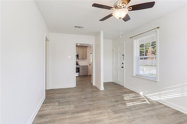 entryway featuring ceiling fan and light wood-type flooring