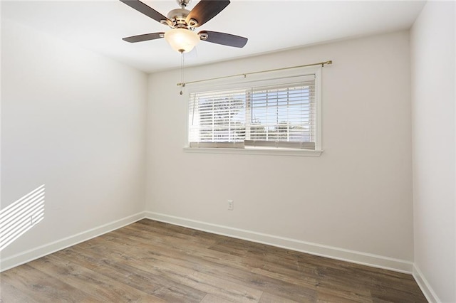 spare room featuring ceiling fan and wood-type flooring