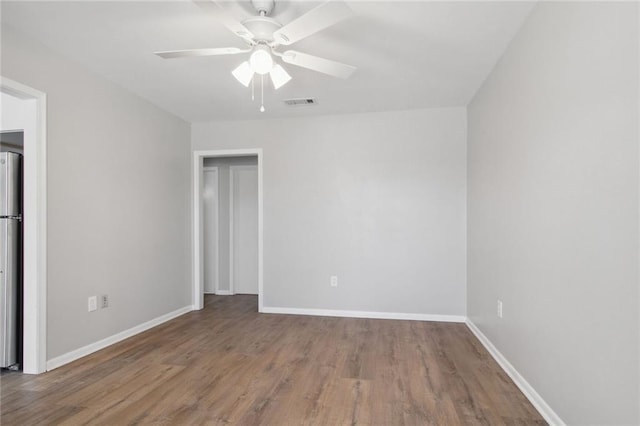 200-202 Pink St, Metairie, LA 70005 - empty room with baseboards, wood finished floors, and a ceiling fan