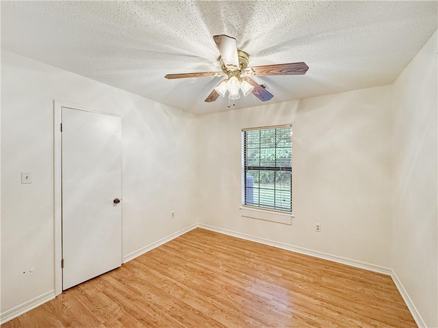 unfurnished room featuring light hardwood / wood-style floors, a textured ceiling, and ceiling fan