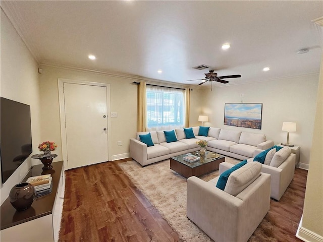 living room featuring ornamental molding, ceiling fan, and wood-type flooring