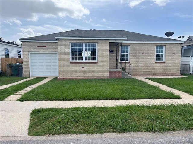 view of front of home featuring a garage and a front yard