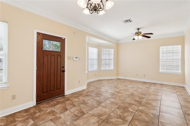 foyer featuring ceiling fan with notable chandelier and crown molding