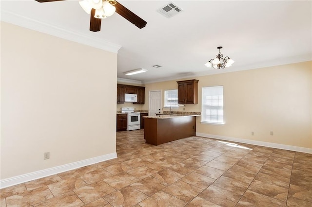 kitchen featuring kitchen peninsula, ornamental molding, white appliances, decorative light fixtures, and ceiling fan with notable chandelier