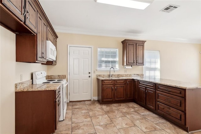 kitchen featuring white appliances, sink, light stone counters, kitchen peninsula, and ornamental molding