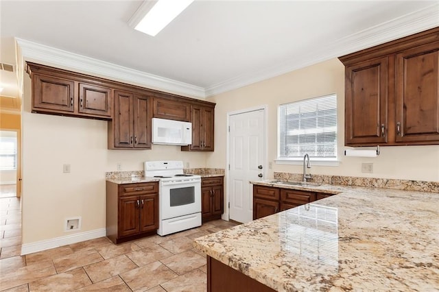 kitchen featuring sink, ornamental molding, white appliances, and a wealth of natural light