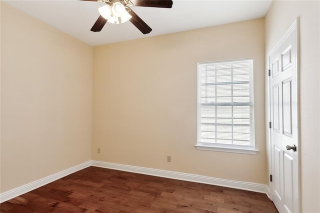 spare room featuring ceiling fan and dark wood-type flooring