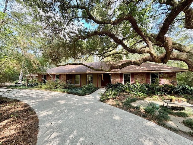 single story home with brick siding