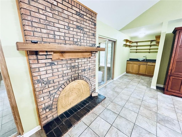 interior space with vanity and vaulted ceiling