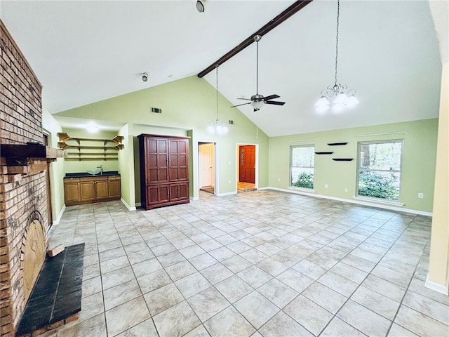 unfurnished living room with beamed ceiling, light tile patterned floors, high vaulted ceiling, a fireplace, and ceiling fan with notable chandelier