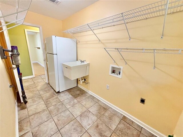 laundry area featuring hookup for a washing machine and electric dryer hookup