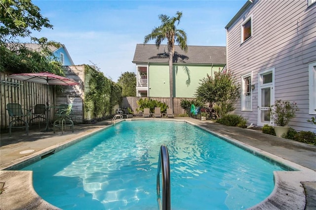 view of pool with a fenced in pool, a patio area, and a fenced backyard