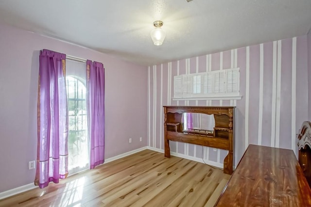 unfurnished living room featuring light hardwood / wood-style flooring