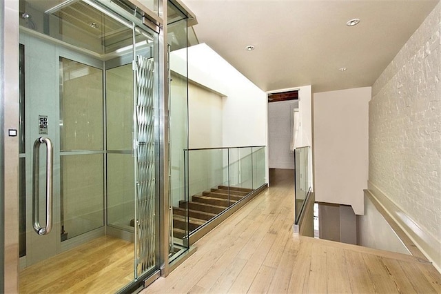 corridor featuring light hardwood / wood-style floors