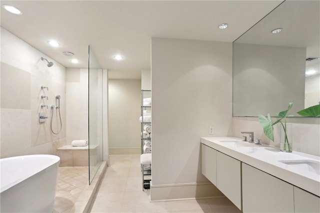 bathroom with tile patterned flooring, plus walk in shower, and vanity