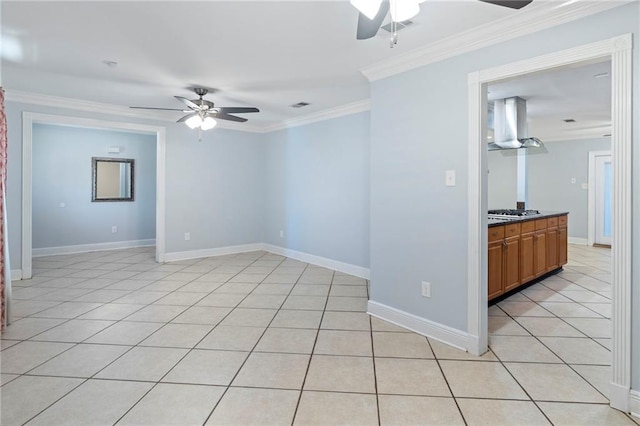 tiled empty room with ornamental molding and ceiling fan