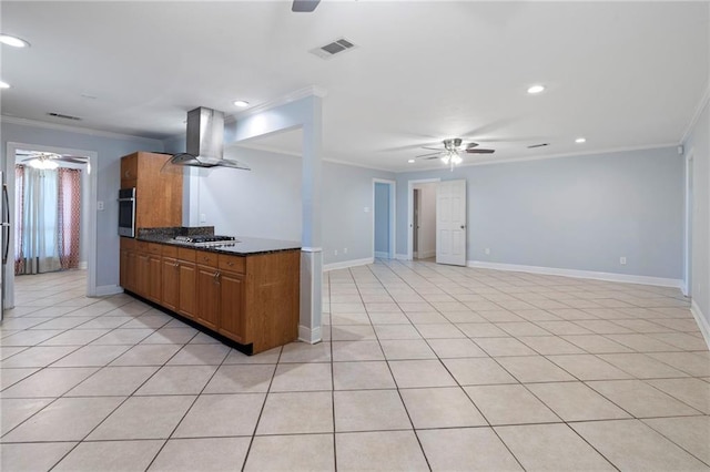 kitchen featuring light tile patterned floors, crown molding, exhaust hood, and stainless steel appliances