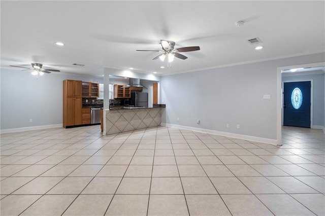 kitchen featuring light tile patterned floors, kitchen peninsula, stainless steel dishwasher, crown molding, and black refrigerator