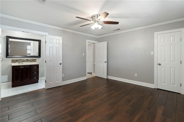 unfurnished bedroom featuring ornamental molding, dark hardwood / wood-style flooring, and ceiling fan