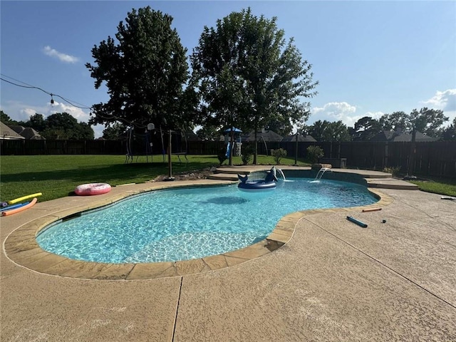 view of pool with a patio, a lawn, and pool water feature