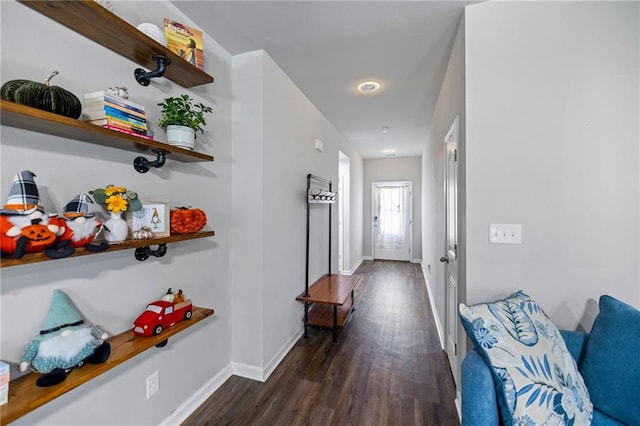 hallway with dark hardwood / wood-style floors