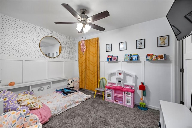 playroom with ceiling fan and carpet