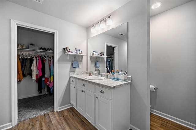 bathroom featuring hardwood / wood-style floors and vanity