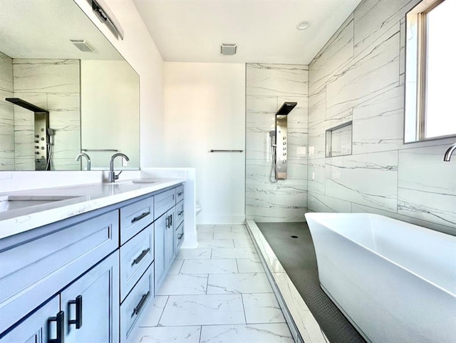 full bathroom with toilet, separate shower and tub, vanity, and tile walls