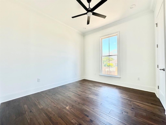 spare room featuring dark wood-type flooring, crown molding, and ceiling fan