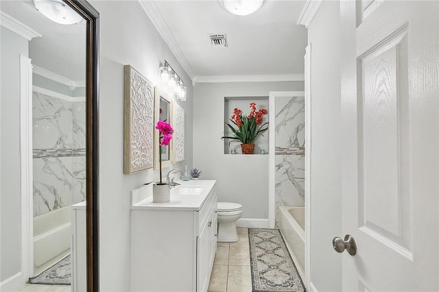 full bathroom featuring tile patterned flooring, toilet, crown molding, tiled shower / bath combo, and vanity