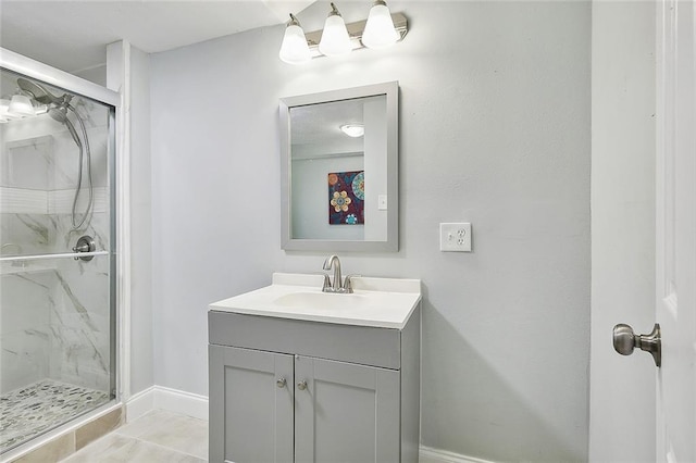 bathroom featuring tile patterned flooring, a shower with door, and vanity