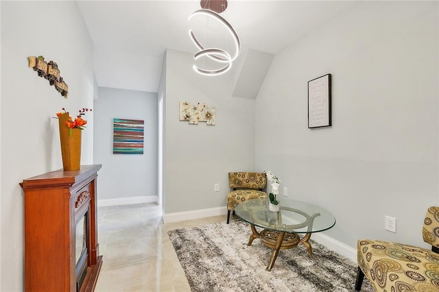 living area featuring lofted ceiling