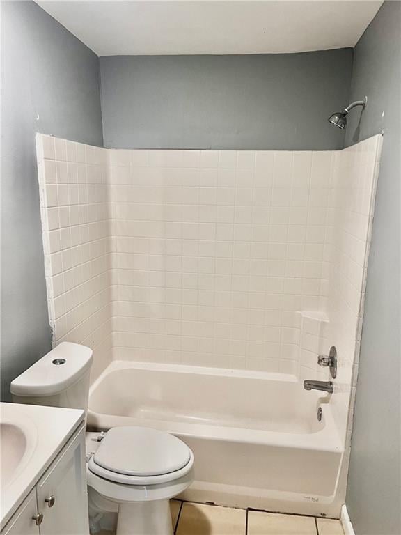 full bathroom featuring tile patterned floors, shower / tub combination, vanity, and toilet