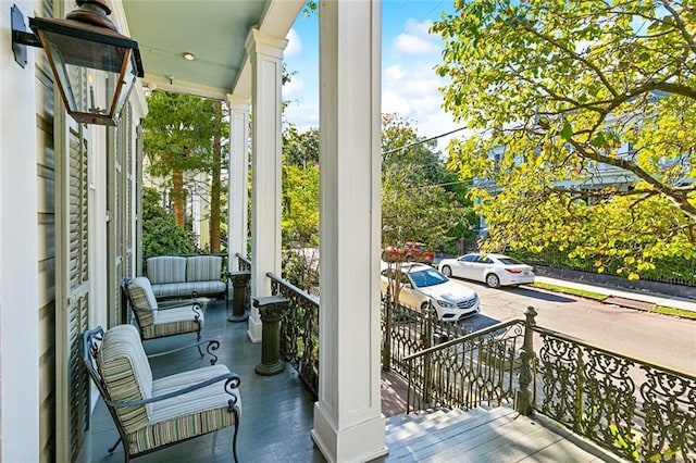 balcony featuring covered porch