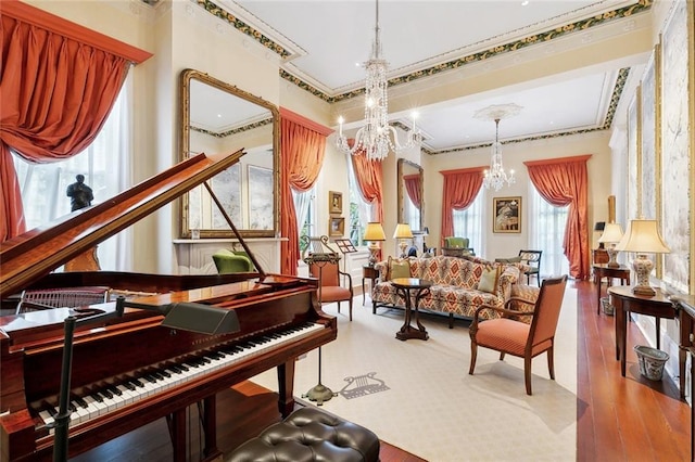 misc room featuring crown molding, a chandelier, and hardwood / wood-style flooring