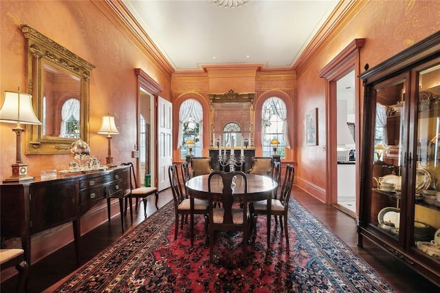 dining area with dark hardwood / wood-style floors and crown molding