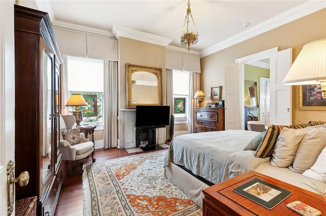 bedroom with dark hardwood / wood-style floors and crown molding