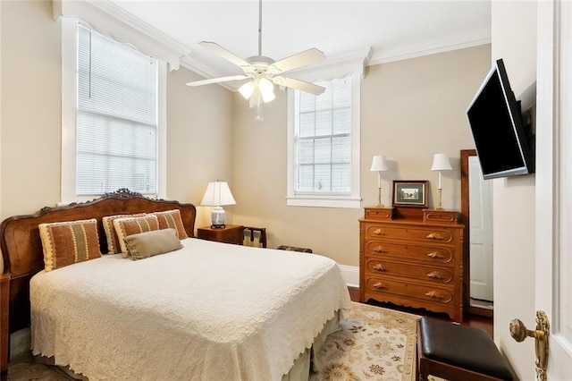 bedroom featuring ceiling fan, dark hardwood / wood-style flooring, and ornamental molding