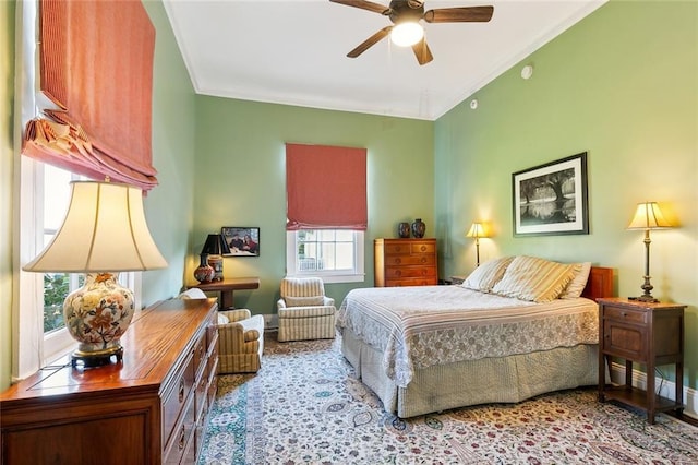 bedroom with ceiling fan and ornamental molding